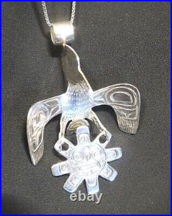 Northwest native American silver Raven and Sun pendant Indigenous art jewelry