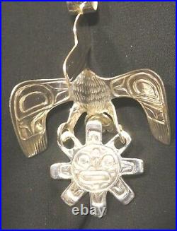 Northwest native American silver Raven and Sun pendant Indigenous art jewelry