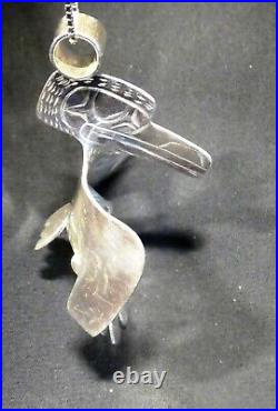 Northwest native American silver Raven and Sun pendant Indigenous art jewelry