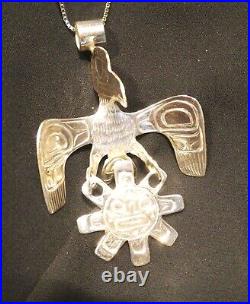 Northwest native American silver Raven and Sun pendant Indigenous art jewelry